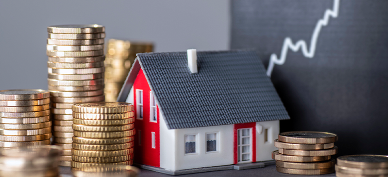 A House with coins, showing rising rates