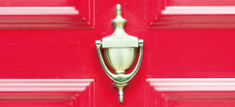 Door knocker on red door