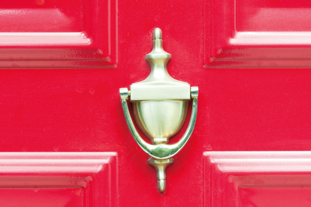 Door knocker on red door